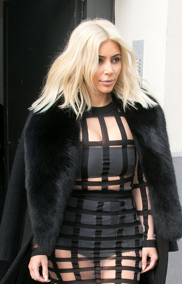 Kim Kardashian into cage dress