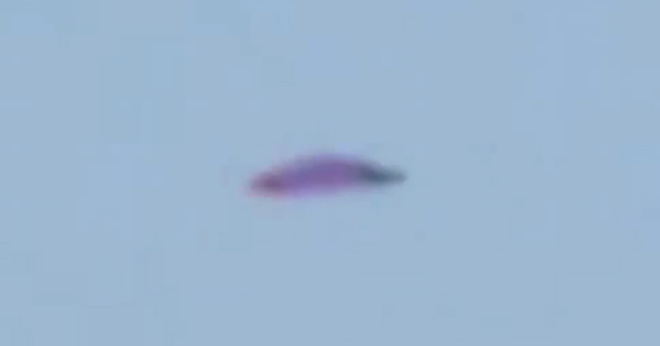 Purple UFO Filmed Hovering Above City Of Lima 